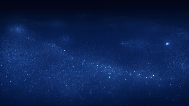 Deep blue background speckled with numerous bright, glowing particles and soft light clusters