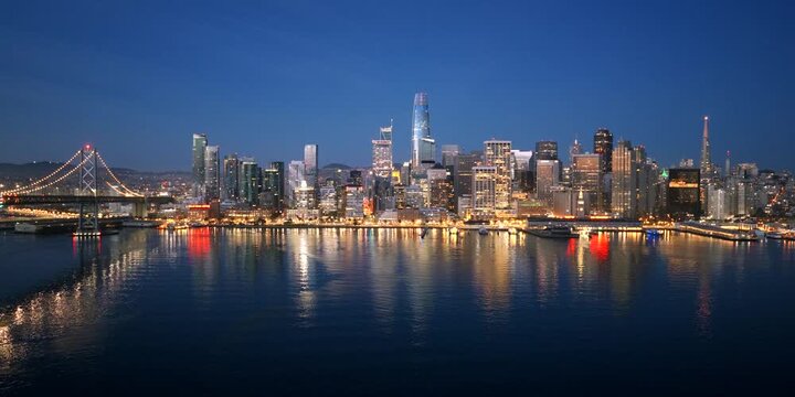 San Francisco - Aerial Approach Over Bay Towards SF Skyline at Blue Hour Dusk with Lights & Reflections
