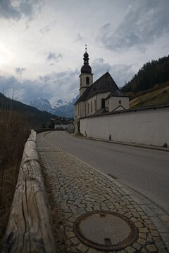 famous viewpoint in Ramsau over the Ramsauer Ache river to the parish church of St. Sebastian