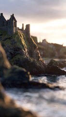 Fototapeta premium Dramatic sunset illuminates ancient Dunluce Castle ruins on rugged coastal cliffs evoking historical grandeur