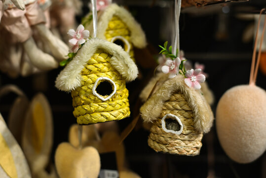 
Easter wicker birdhouses hang in a decor shop