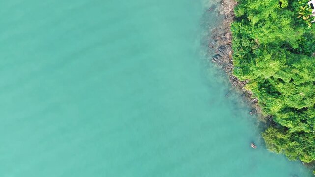Top down aerial turquoise sea water Phuket southern Thailand