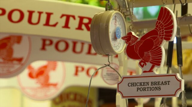 Chicken Breast Poultry sign in food market butcher weighing scales