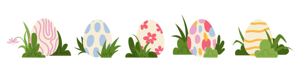 Set cute Easter eggs decorated with pastel patterns and spring flowers, arranged with green grass. For Easter greeting cards, holiday decorations, packaging and seasonal designs. © miss LEMON