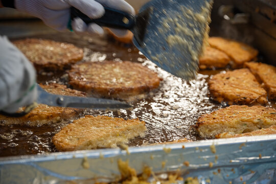 Traditional Korean mung bean pancakes known as Bindaetteok being fried at Gwangjang Market in Seoul