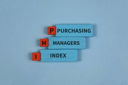 Wooden blocks spell out Purchasing Managers Index (PMI) on a blue background, symbolizing business performance, economic indicators, market analysis.