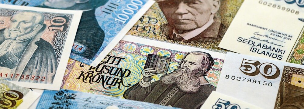 Icelandic krona money bills pile on table. Iceland banknotes of ISK currency close up. Concept of business, economy and banking in Iceland