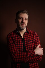 Obraz premium Brutal man with beard on dark background