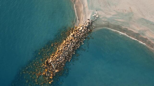 Roccella Ionica Beach with Coastal Protection in Calabria, overhead aerial