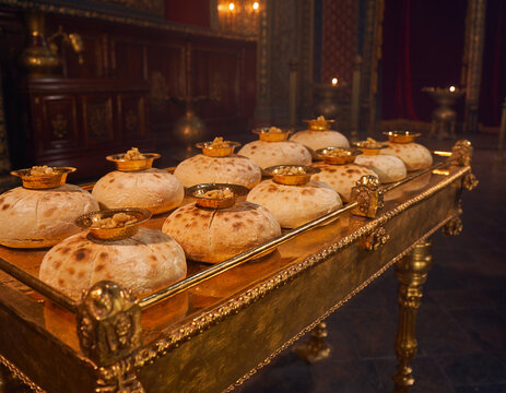 Close up of pure gold table holding twelve loaves of unleavened showbread