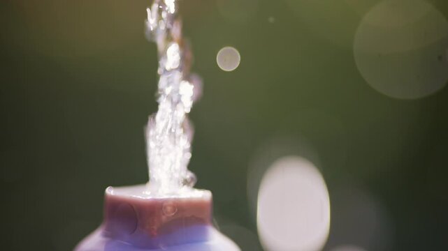 Water flowing up from a fountain nozzle