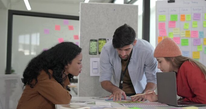 UX,UI designers collaborate to choose color schemes for mobile app focused on monitoring energy usage and carbon footprint. Using color wheel and design mockups to finalize the app visual aesthetics.
