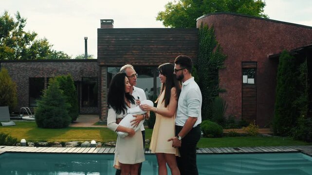 The arrival of a child in a family is always a celebration in a modern country house by the pool with a beautiful landscape design.