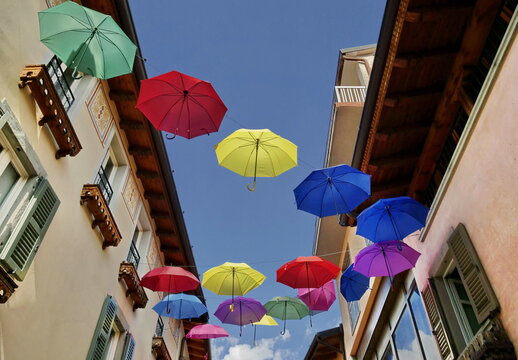 Colorated umbrellas installed in between the streets in Clusone, Lombardy, Italy