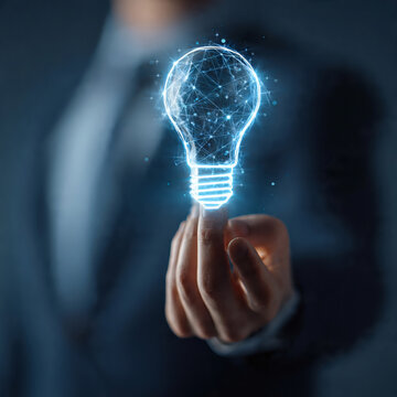 Futuristic businessman holding holographic light bulb icon, digital interface, innovation and startup concept, blue neon light