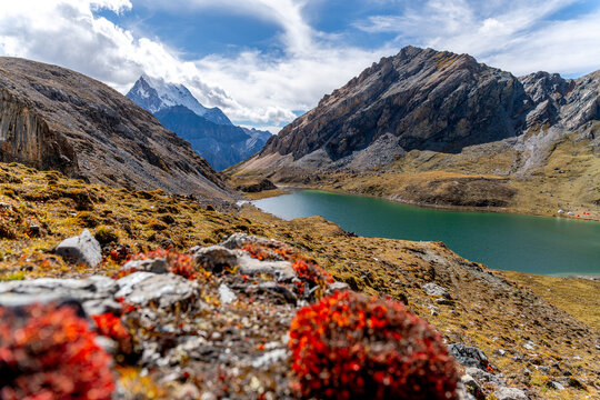 Scenic alpine landscapes along the Yading Big Kora and the famous Rock Trail in Daocheng Yading, Sichuan, China, featuring sacred snow mountains, high-altitude valleys, drifting clouds, glacial lakes,