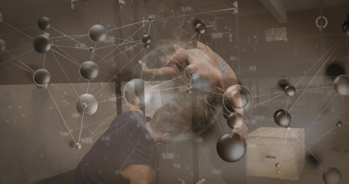 Vertical video: Gymnast leaning back launching flip, coach catching hips for gym safety amid nodes