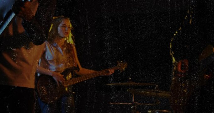 Lead guitarist playing and singing starting riff with waves pulsing from guitar to lead music show