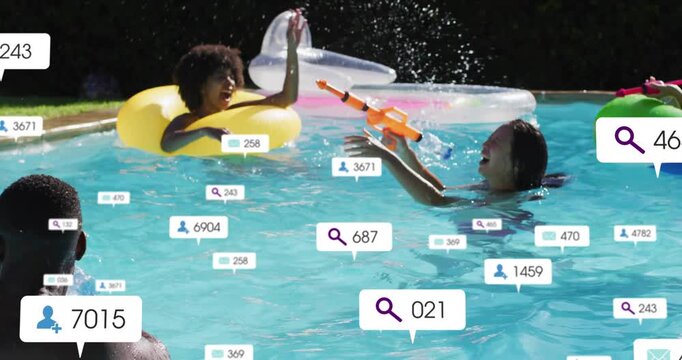Vertical video: Man firing water gun at group in pool for fun, tech badges popping over people