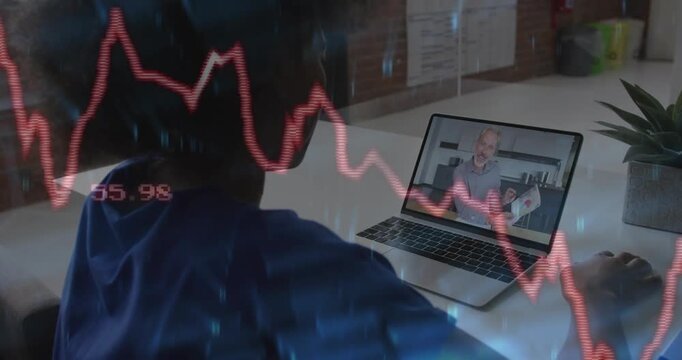 Female viewer in headset watching host on laptop, gestures causing overlaid red graph for finance