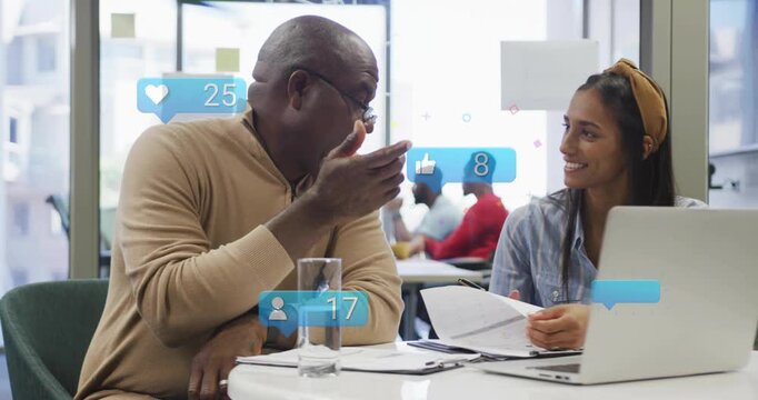 Mentor pointing docs while woman typing laptop, causing likes updating, finalizing marketing