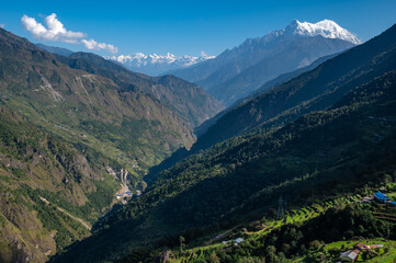 Fototapeta premium Ganesh himal range seen on the way to Syafrubesi, Nepal. Ganesh Himal, named after the Hindu God Ganesh (the legendary elephant headed god), is a sub range of the Himalayas, located in the north centr