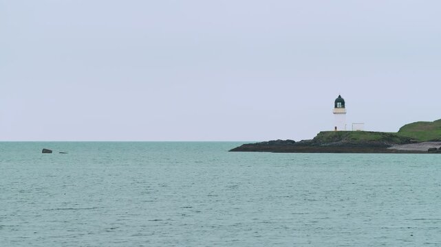 Static shot of the lighthouse in Stornoway on a cloudy day.