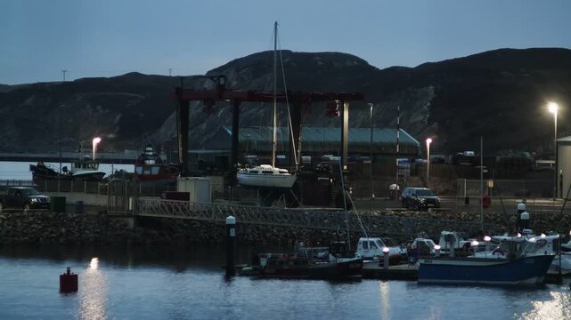 Time lapse shot of yachts under repair in Stornoway harbour on the Hebrides.