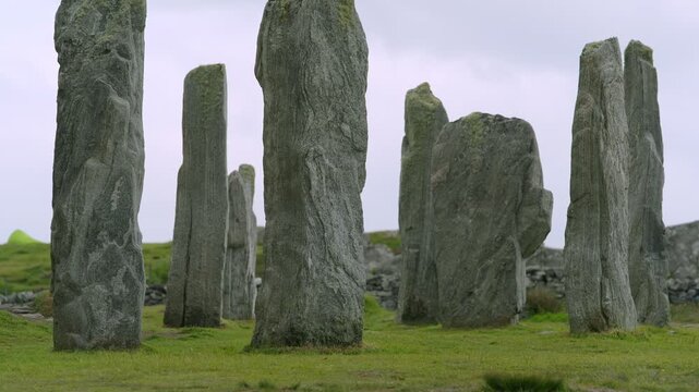 Static shot of the Callanish standing stones arranged around the burial chamber.