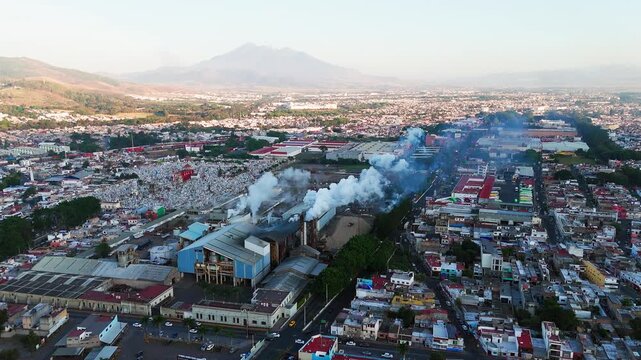 Industrial sugar mill polluting the air with thick smoke from its chimneys in tepic, nayarit, mexico