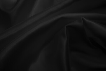 Fototapeta premium Black silk fabric texture. Abstract cloth background
