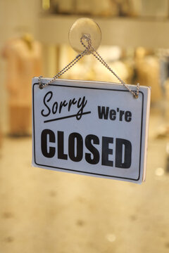 Store displays closed sign during business hours