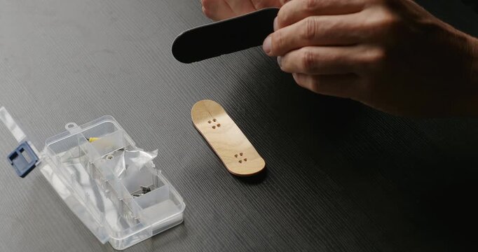 Assembly wooden fingerboard skateboard.	