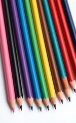 Fototapeta premium Rainbow-colored pencils neatly arranged ready for creative drawing