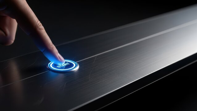 Finger pressing glowing blue start button