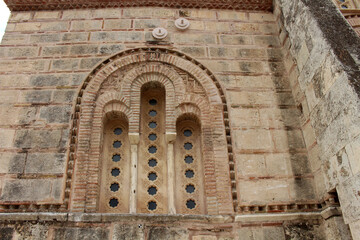 Fototapeta premium Ornate brick arches entrance August 2024 Vertical perspective of historic church facade Athens