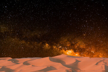 milky way and milky way over the desert in the night. the stars in the middle.