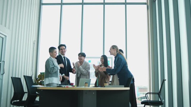 Multiracial Businessperson united commitment partnership, synergy and harmony business company worker with solidarity strategy goal motivation, group of cheerful professional teamwork in firm meeting.