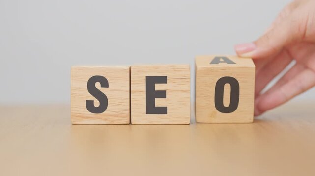 Hand change Wooden block from SEA to SEO. Search Engine Optimization, SEM, Advertising, Marketing, Idea, Strategy, Keyword, Content and technology concept