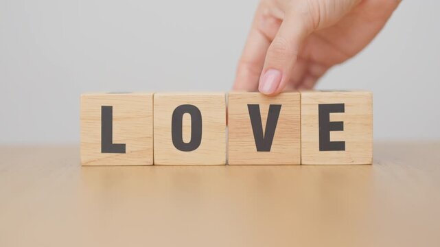 hand change wooden block Lose to Love. Heartbreak, lost, move on, mindset, motivation and Heal concept