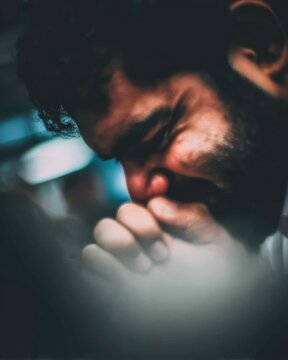 Deep in Thought: A Moment of Reflection and Solitude in Low Lighting