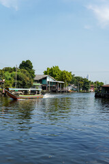 Fototapeta premium landscape of Bangkok city the capital of Thailand, atmosphere of the development of the city there are building, river and buddhist temple.