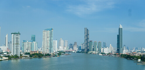 Fototapeta premium landscape of Bangkok city the capital of Thailand, atmosphere of the development of the city there are building, river and buddhist temple.