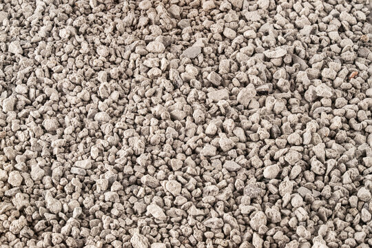 Textured Background of Mineral Filler Granulate Top View &ndash; Natural Absorbent Material for Pet Litter, Plant Substrate or Construction Aggregate