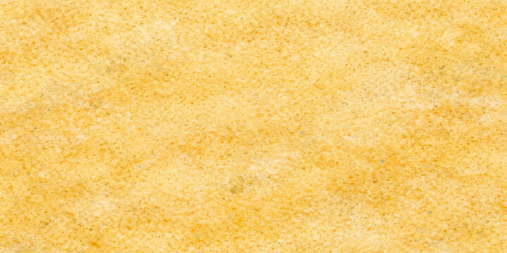 Abstract macro detail of a yellow wool fabric texture with a soft sponge pattern and beige wheat tones resembling a textured bakery bread background