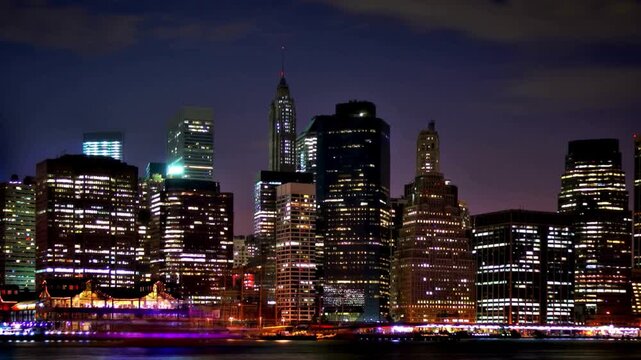 Stunning beauty of  New York City at night, aerial view of Lower Manhattan and East River at Night. The energy and density of America's most famous  metropolis.
