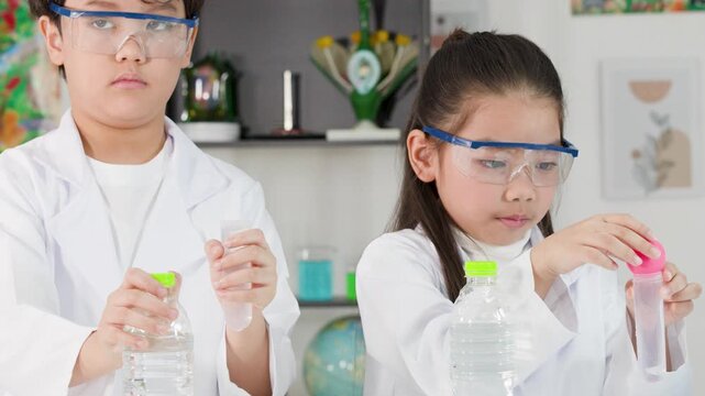 Asian Students Conduct Bernoulli Principle Science Experiment with Ping Pong Balls