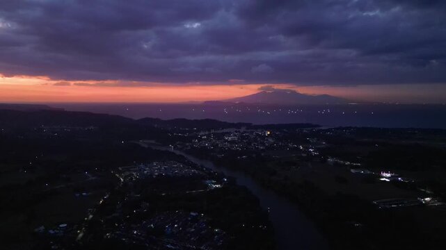 Drone aerial view capturing sunset skies over Maragondon Cavite as daylight slowly transitions into evening atmosphere.