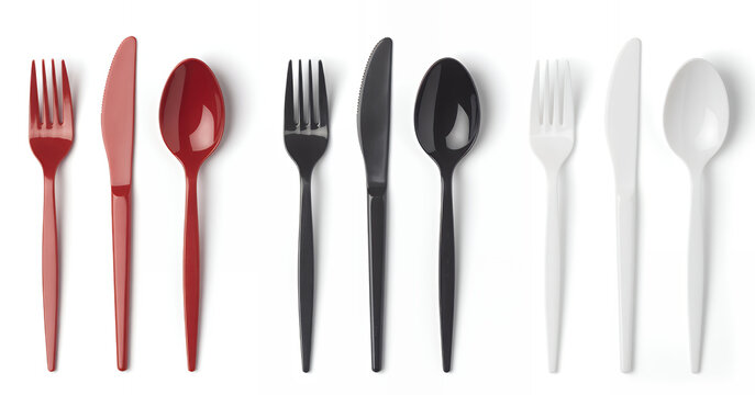 Assorted plastic utensils on white background disposable forks knives spoons