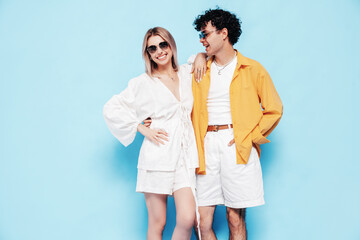 Happy beautiful romantic teenage couple. Smiling handsome caucasian man and young woman in summer...